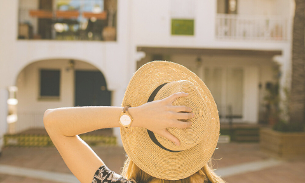 Woman holding hat