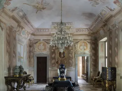 Villa Balbiano lake Como historical property available for exclusive rental ad events magnificent Grand Salon on ground floor 17th century frescoes chandelier antique furniture stone floor