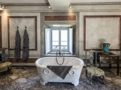 Villa Balbiano luxury exclusive property Lake Como Milan second floor suite classic bedroom antique furniture marble bathroom 17 century Durini interiors
